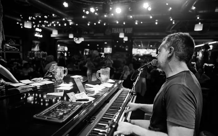 Solo piano entertainer performing at a bar