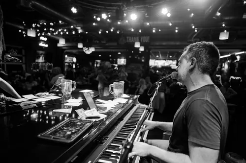Solo piano entertainer working a packed bar